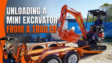 unloading mini excavator on trailer